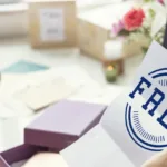 Woman opening up letter that says free as she sits in front of laptop