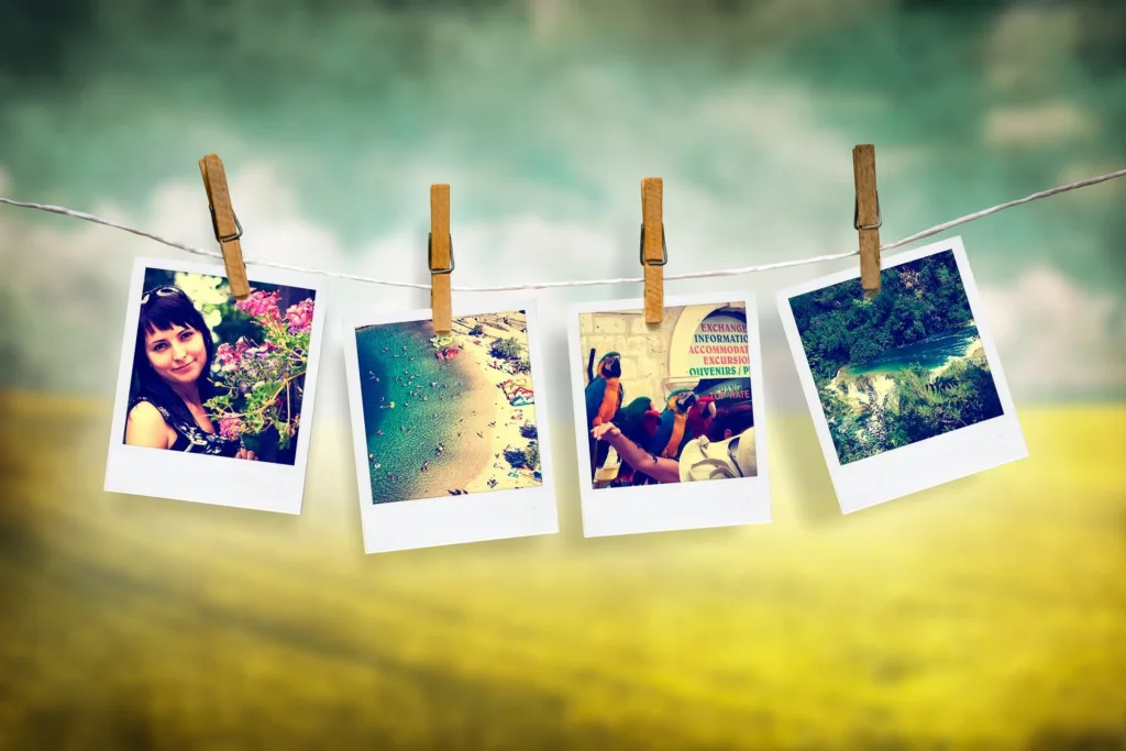 Four Polaroid images hang on clothesline with wooden pegs